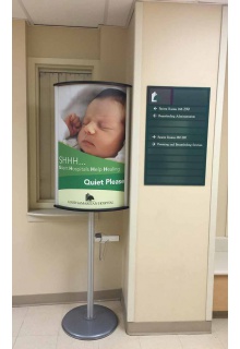 Stand holds 2 of 24x36 poster for double sided viewing 2-sided curved 24x36 poster stand with literature holder